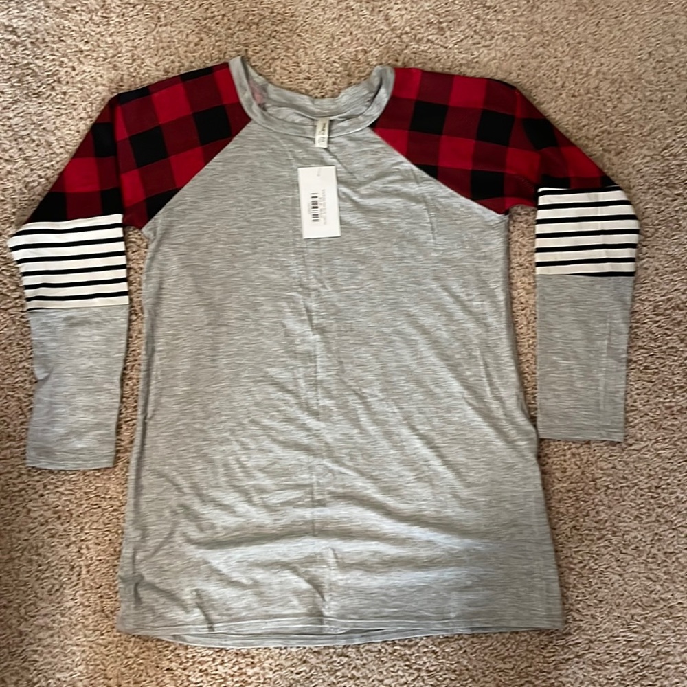 NWT cute plaid top. Material is very soft